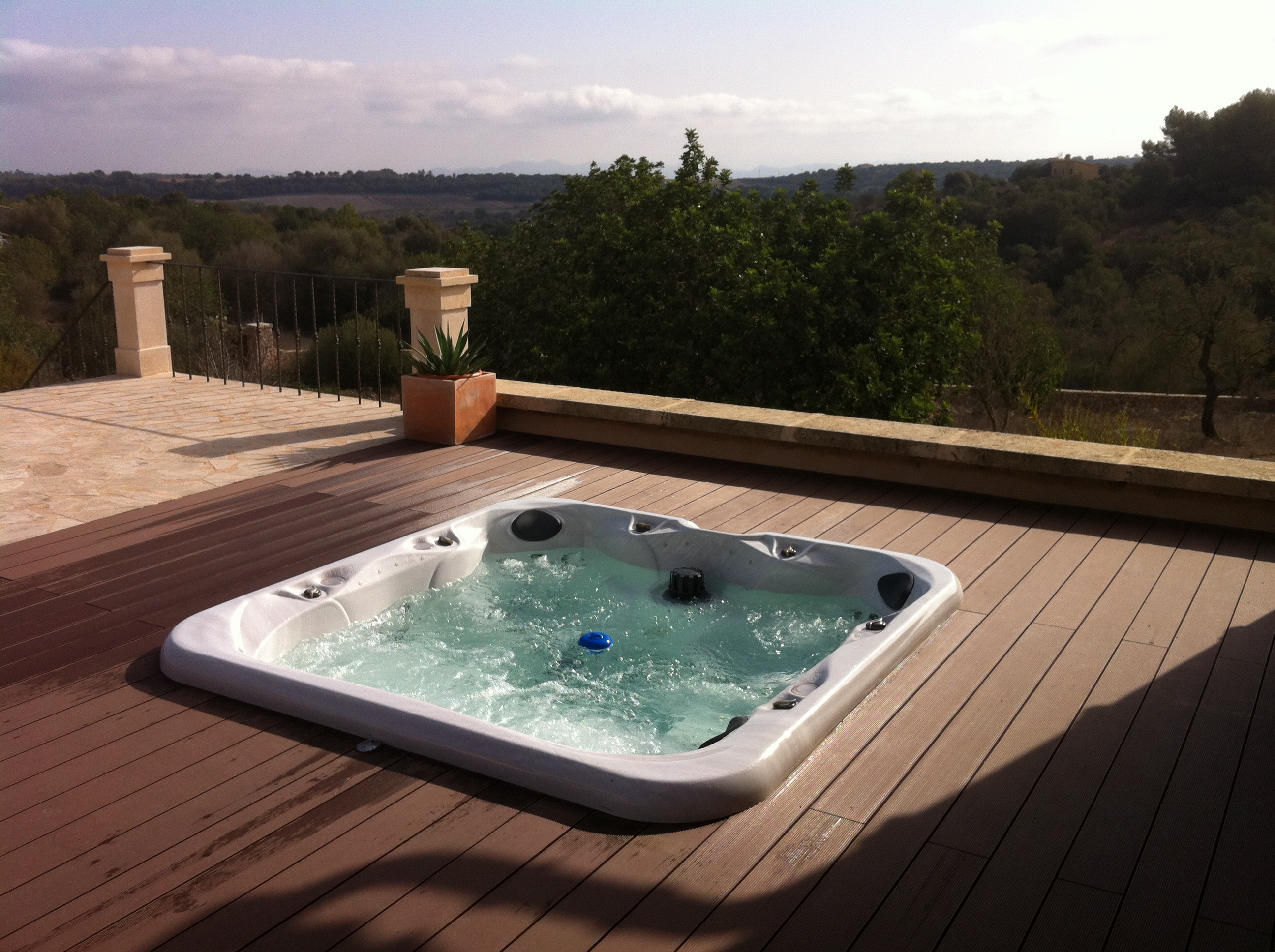 Luxury outdoor jacuzzi on wooden deck with Mallorca countryside view